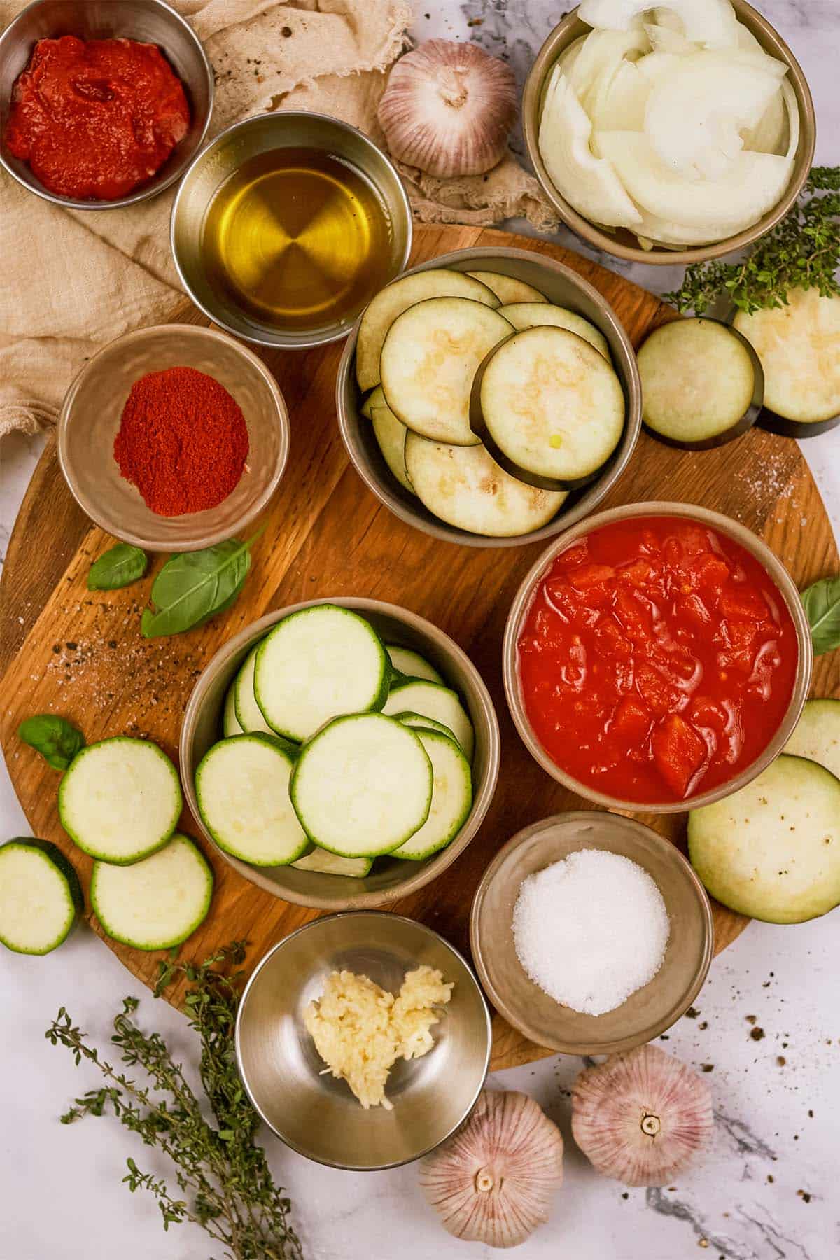 overhead view of ingredients to make Tomato and Houllimi Bake laid out on a table