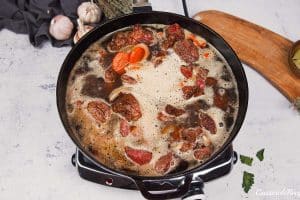 covering the other ingredients with broth to make the best beef casserole recipe