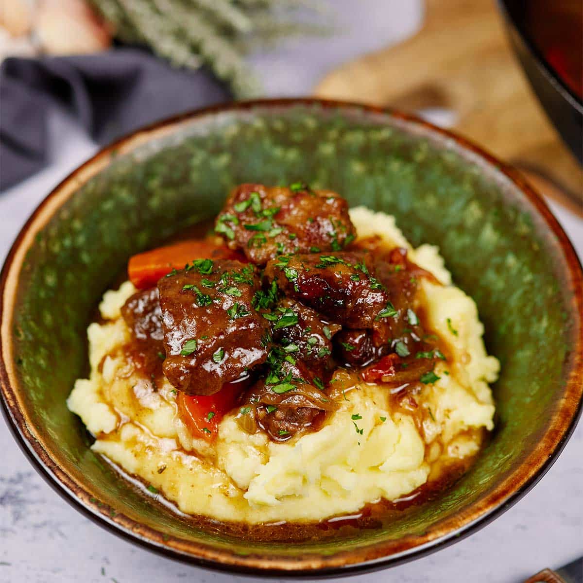 bowl with a serving of best beef casserole recipe on a table