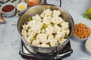 sautéing cauliflower florets to make buffalo cauliflower and chickpea casserole