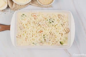 topping chicken divan with cheese prior to baking