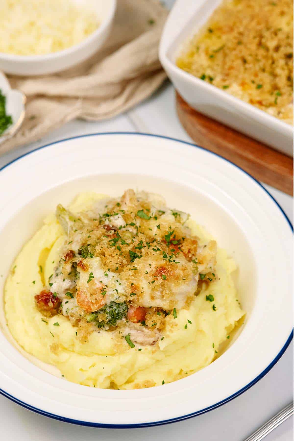 serving of chicken divan in a bowl on a table ready to enjoy