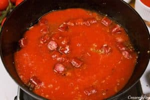 combining ingredients to make a sauce for chorizo gnocchi bake