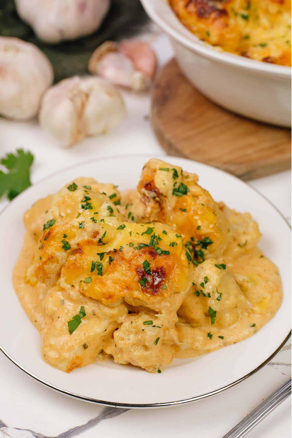 plate filled with a serving of creamy cauliflower casserole