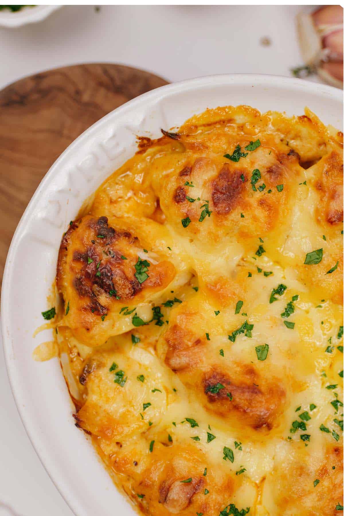 closeup of creamy cauliflower casserole in a baking dish