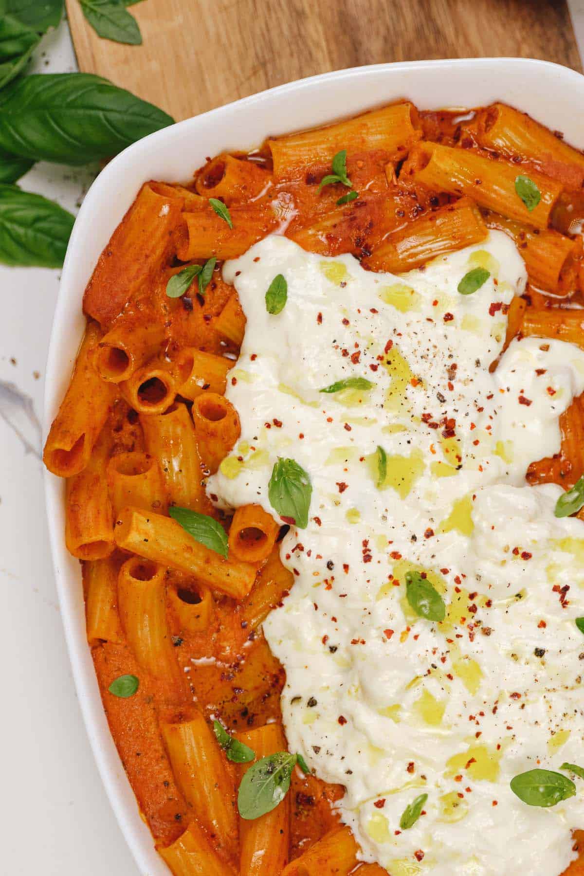 baking dish of creamy sun-dried tomato and roasted red pepper casserole