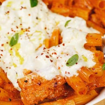 closeup of a pasta-filled creamy sun-dried tomato and roasted red pepper casserole