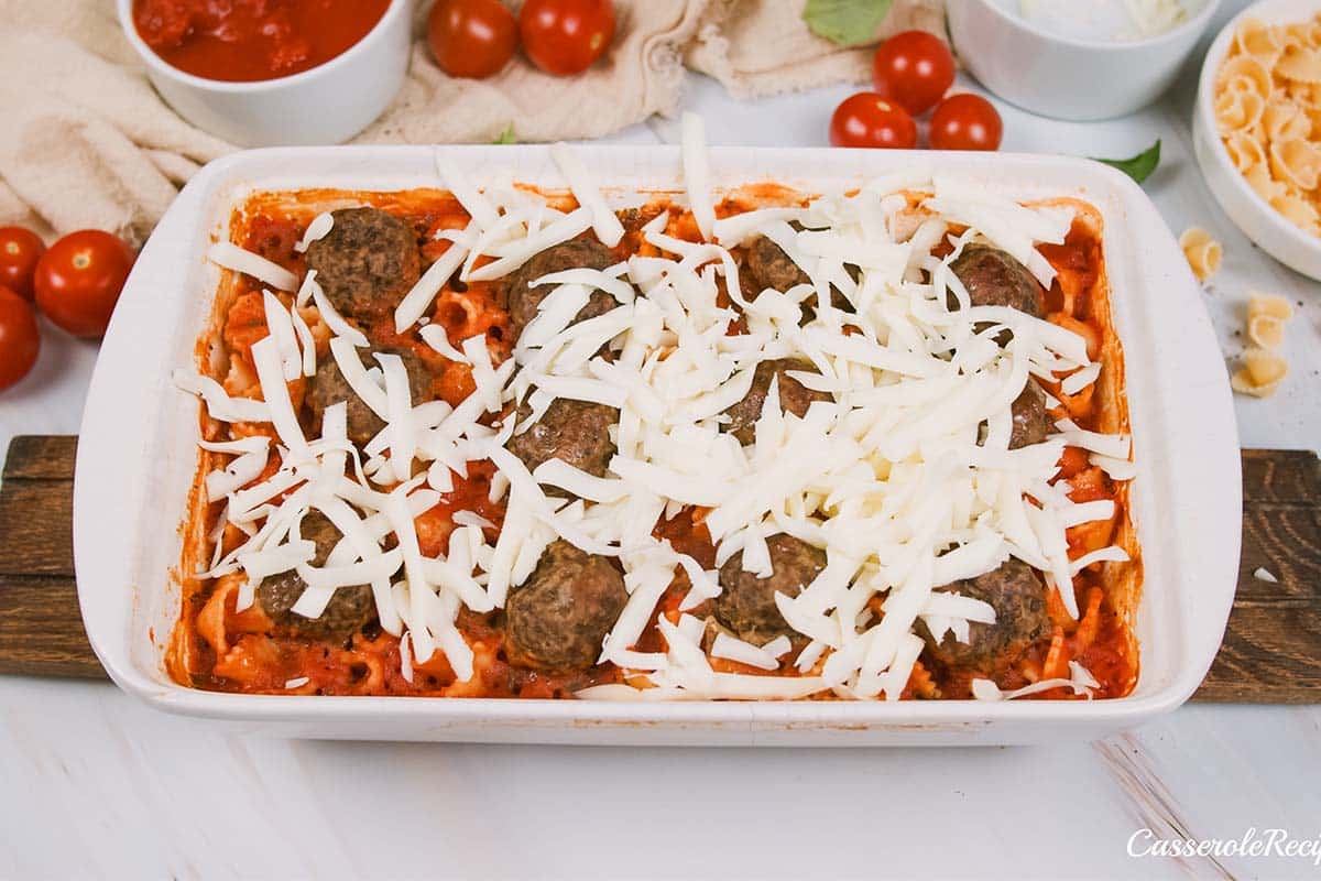 baking dish of dump and go meatball lasagna on a table prior to baking for the final time prior to serving