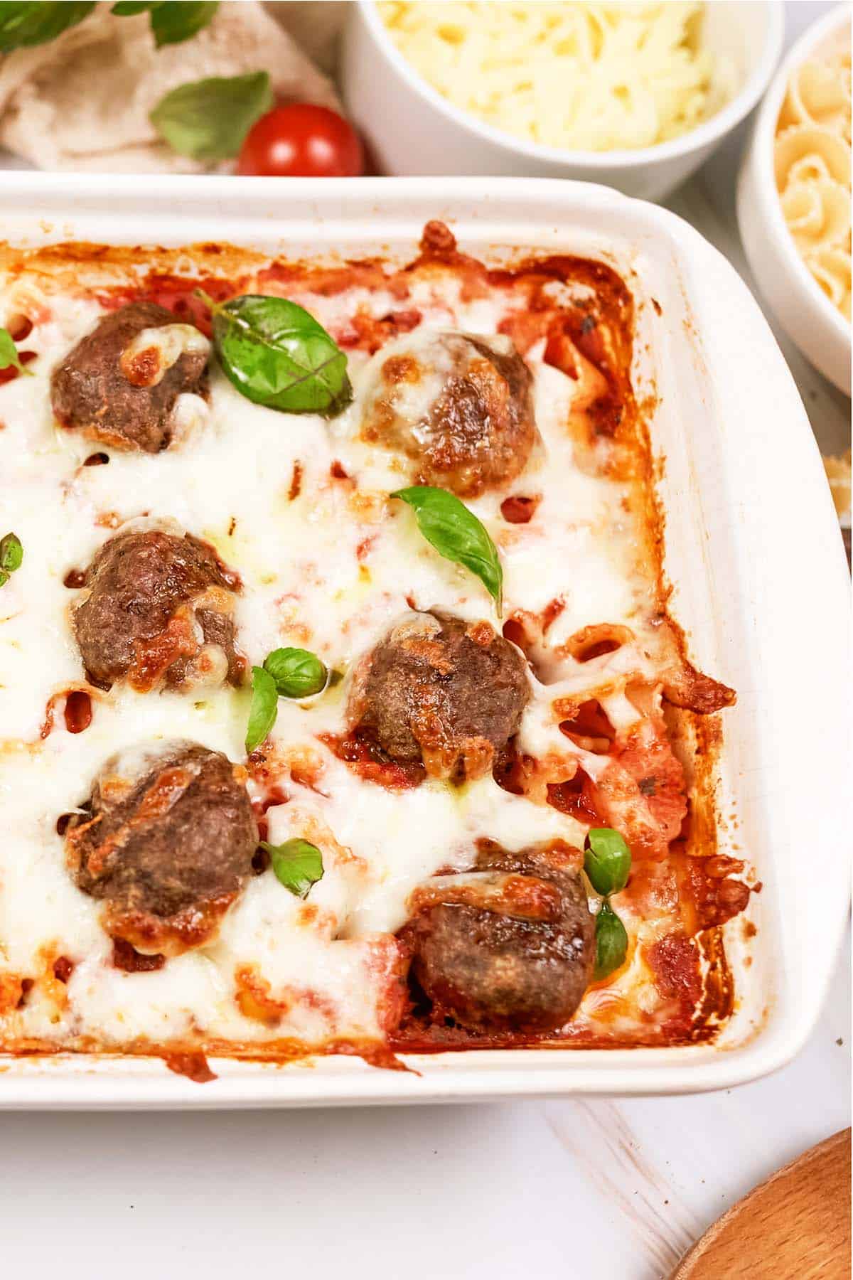 closeup of a baking dish of dump and go meatball lasagna on a table