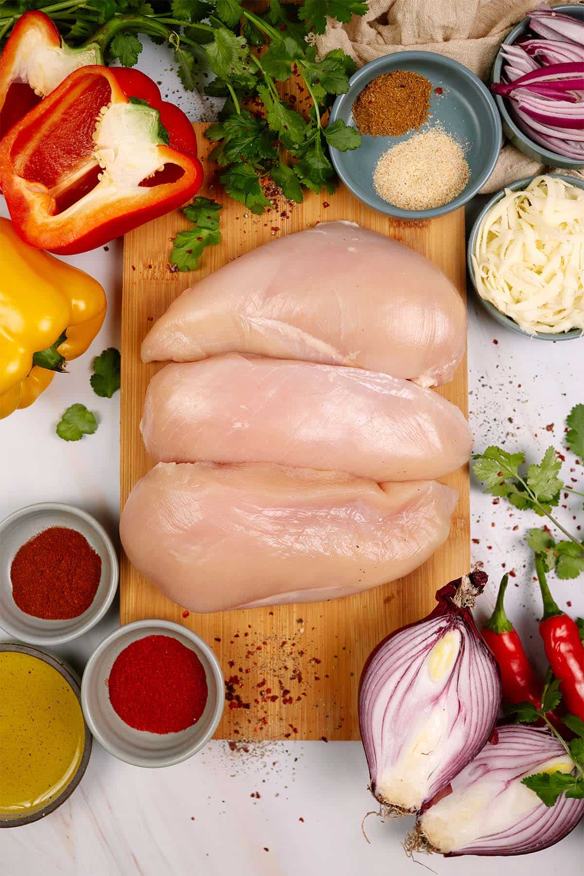 ingredients laid out on a table to make fajita chicken bake