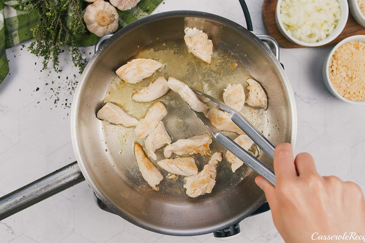 sautéing chicken to make garlic cheddar chicken bake