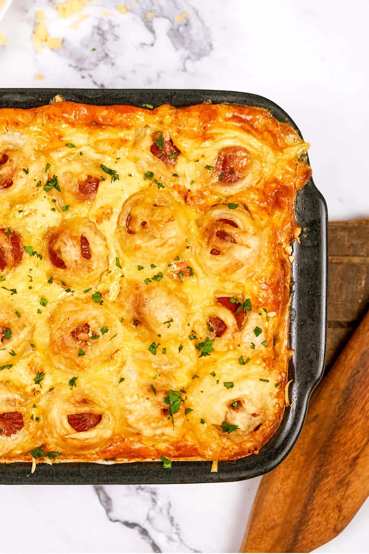 baking dish of pigs in a blanket breakfast casserole