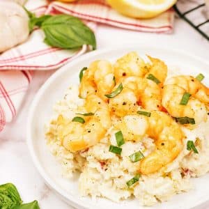 serving of shrimp and cauliflower bake on a white plate