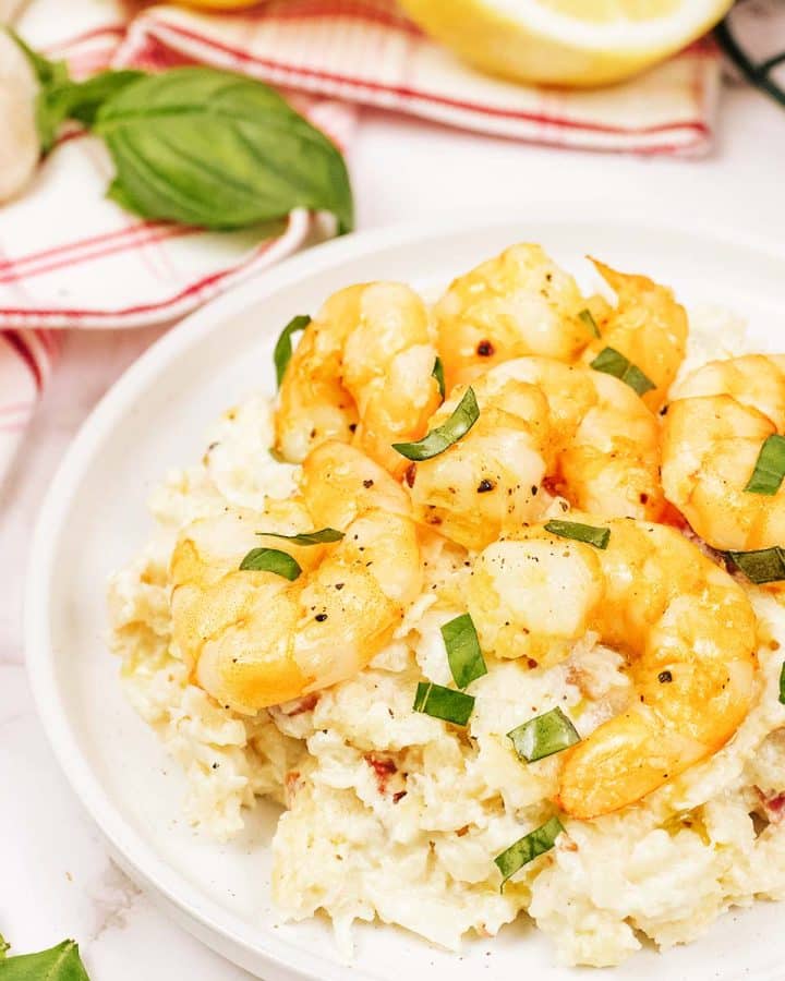 serving of shrimp and cauliflower bake on a white plate