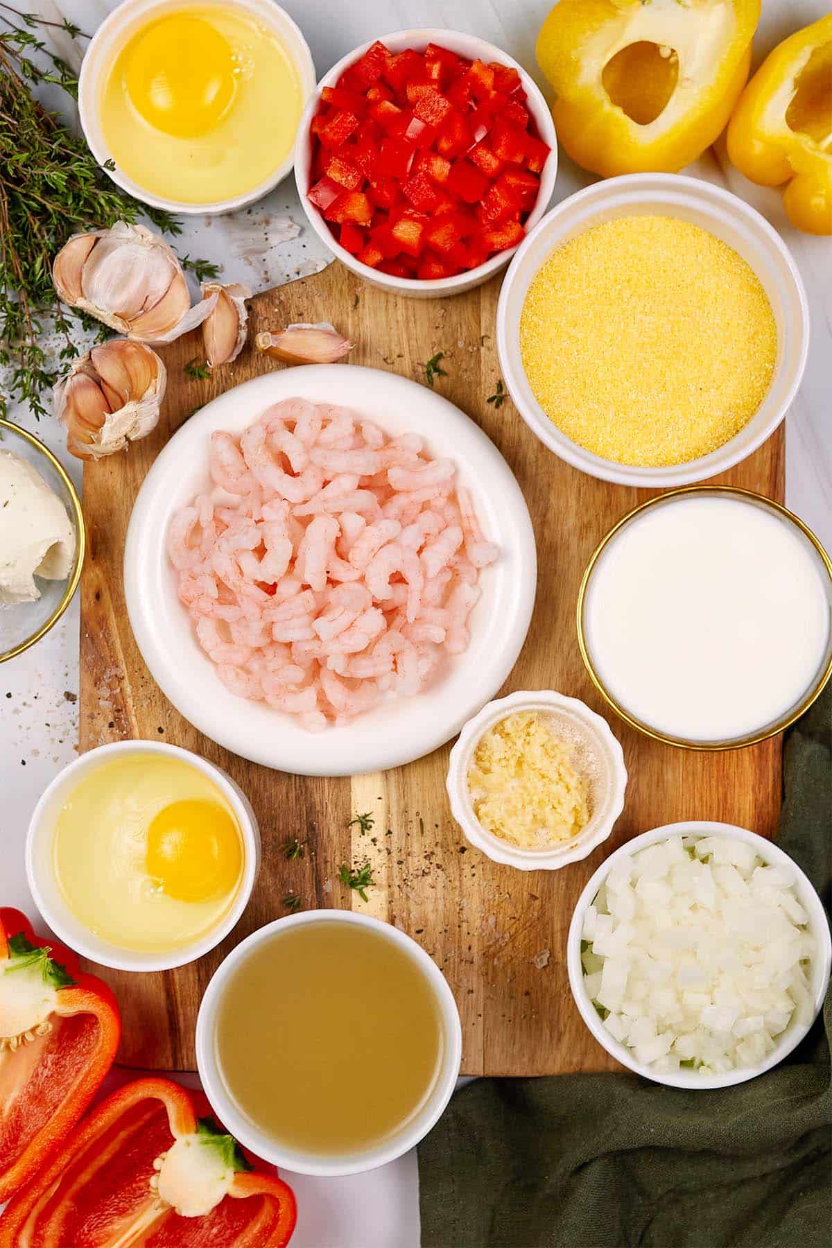 ingredients to make shrimp and grits bake laid out on a table