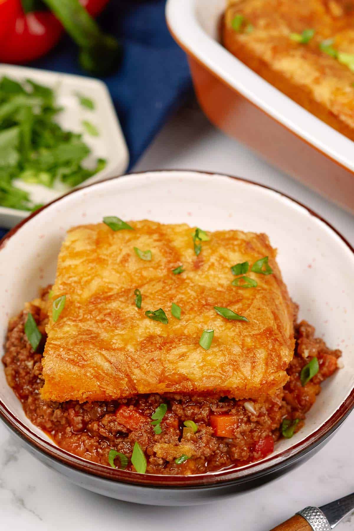 bowl filled with a serving of flaky sloppy joe casserole on a table