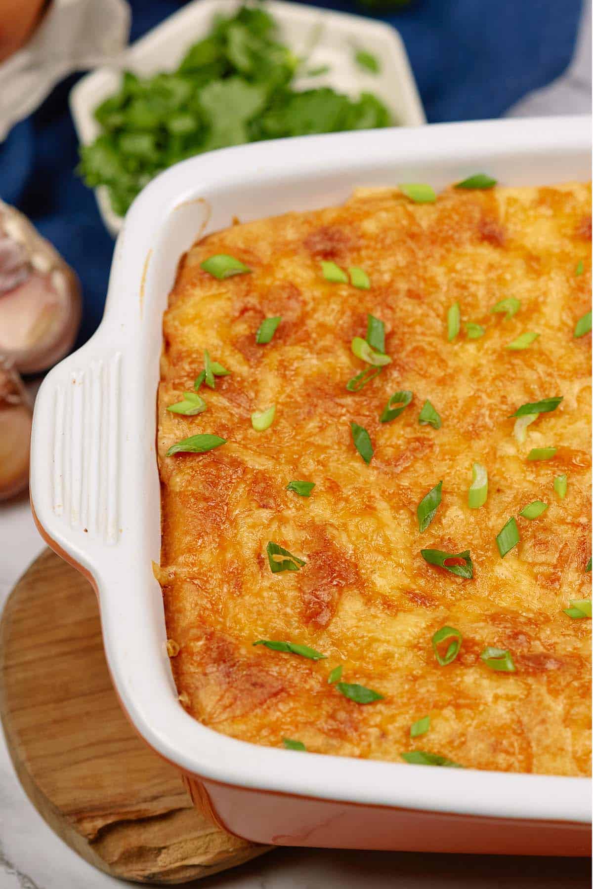 baking dish of flaky sloppy joe casserole with ingredients surrounding it