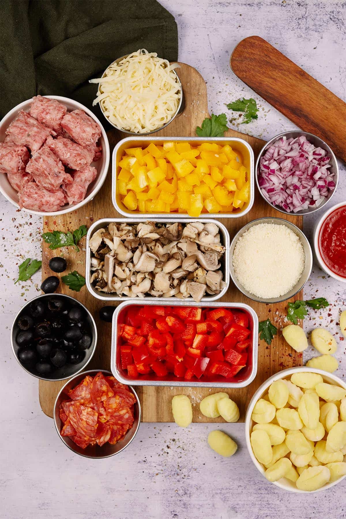 ingredients laid out to make supreme pizza gnocchi on a table