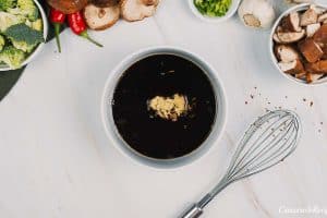 sauce ingredients being combined to make teriyaki tofu rice casserole