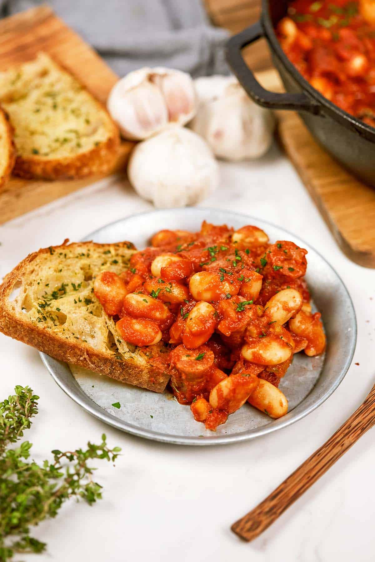 plate filled with vegan sausage casserole on a slice of toast