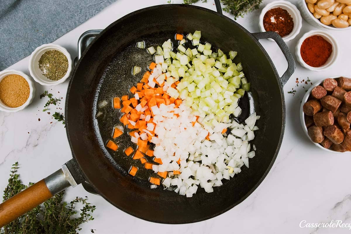 onions and veggies being sautéed to make vegan sausage casserole