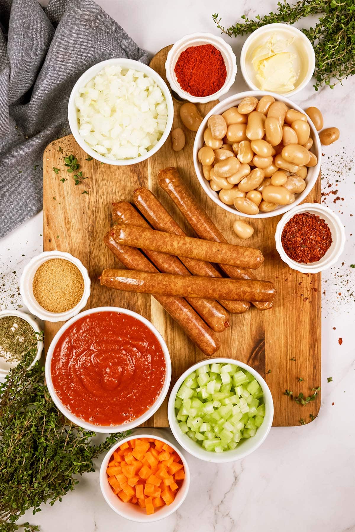 overhead view of ingredients to make vegan sausage casserole on a table