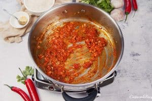 ingredients being sauteed to make Chicken Panang Casserole