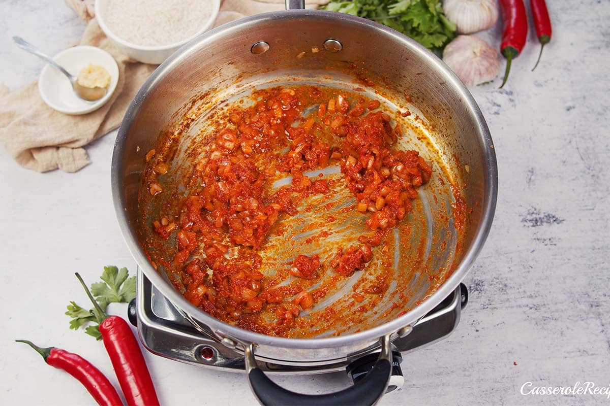 ingredients being sauteed to make Chicken Panang Casserole
