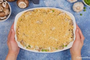 spreading breadcrumbs over Tetrazzini Casserole prior to baking