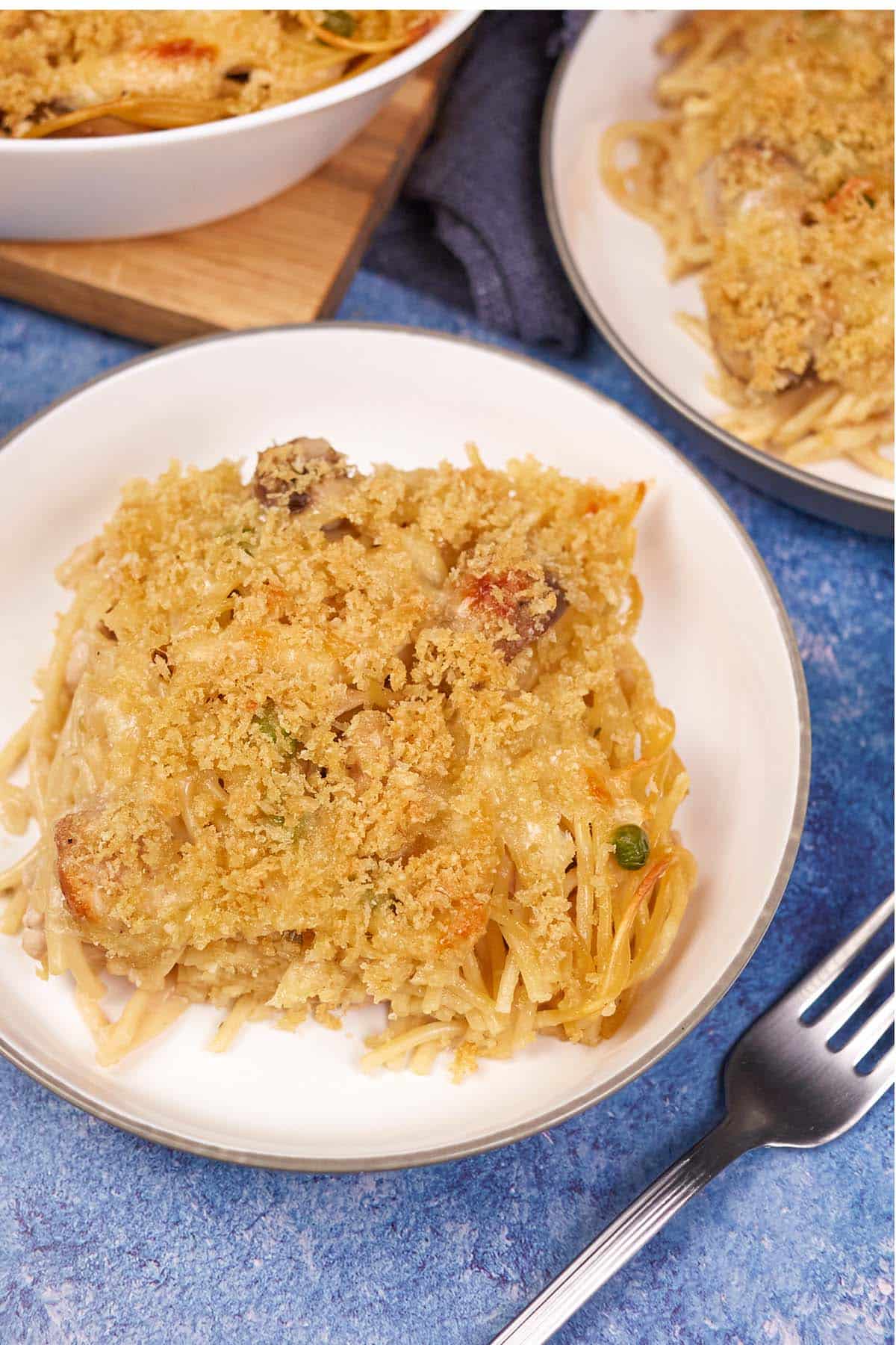 serving of Tetrazzini Casserole on a white plate ready to enjoy