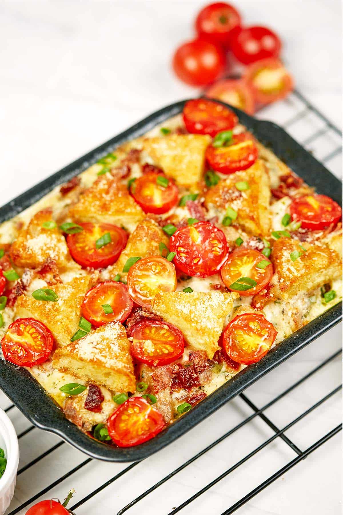baking dish of alfredo bacon tot casserole ready to serve