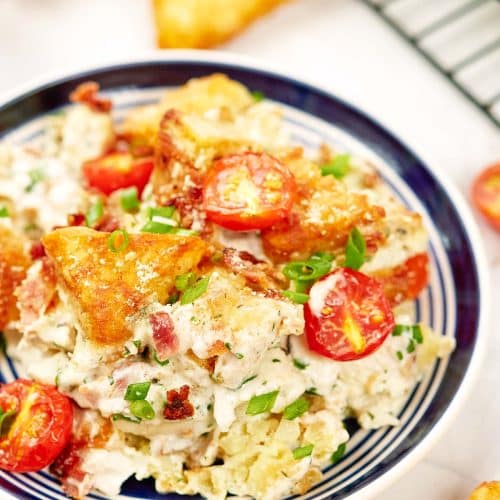 alfredo bacon tot casserole served in a bowl ready to enjoy