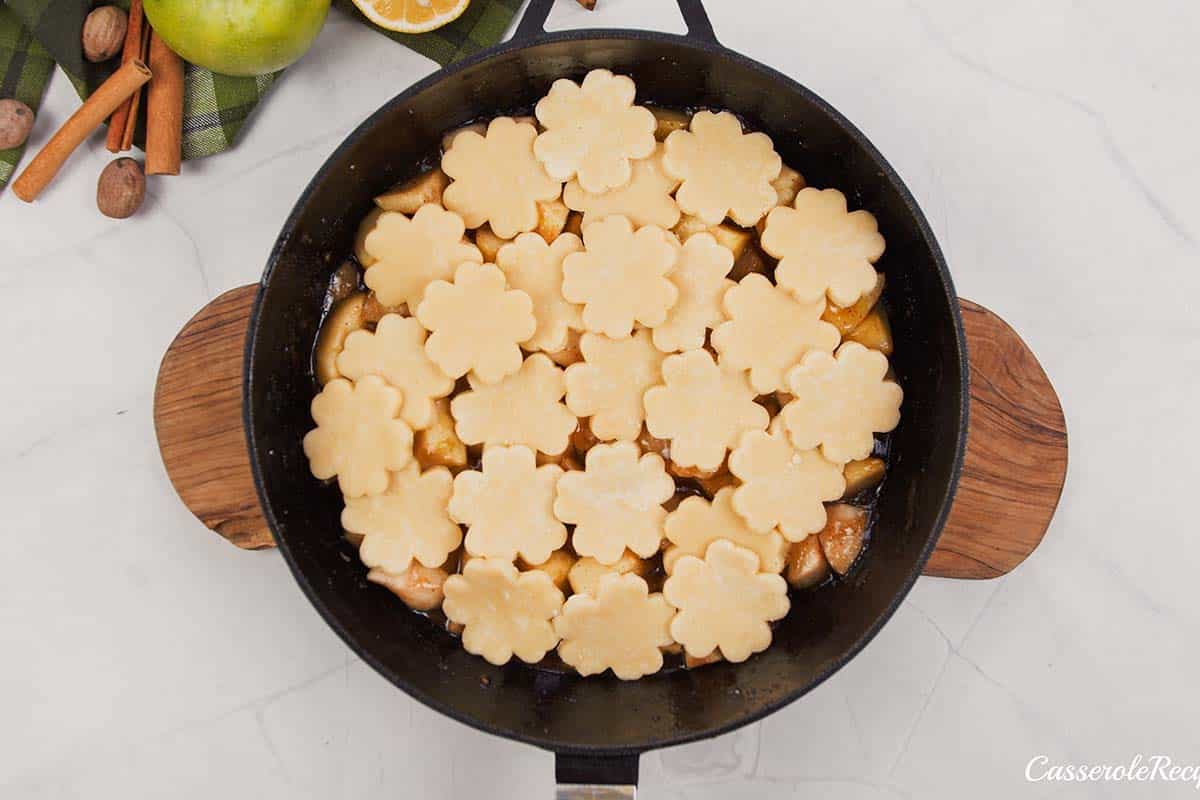 apple pandowdy on a table being prepared to be baked
