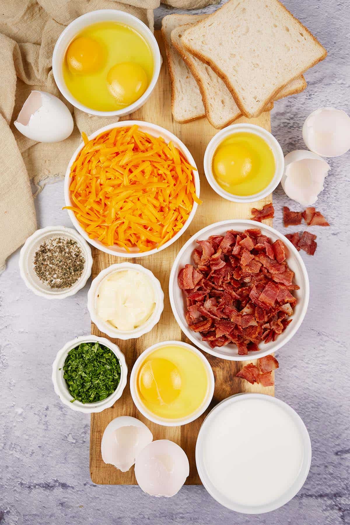 ingredients to make bacon grilled cheese sandwich casserole laid out on a table