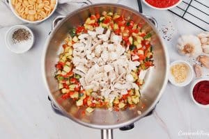 combining ingredients to make baked cavatelli casserole