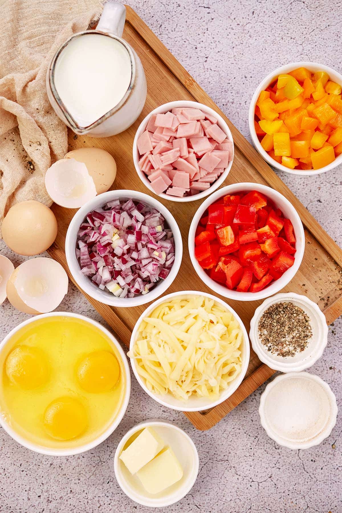 ingredients to make baked denver omelette laid out on a table