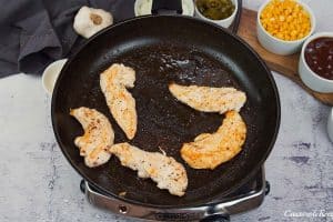 chicken being cooked on a frying pan to make bbq chicken pot pie