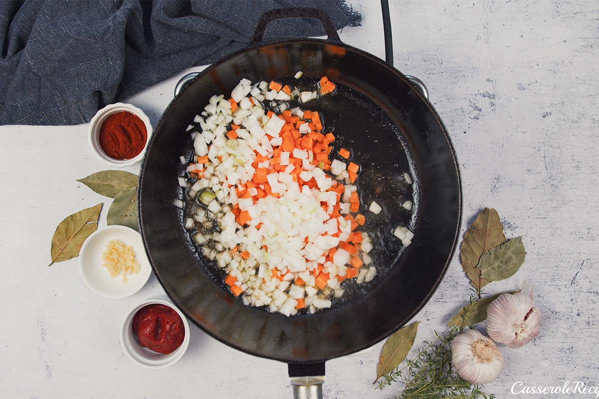 sauteeing carrot and onion to make best ever sausage casserole