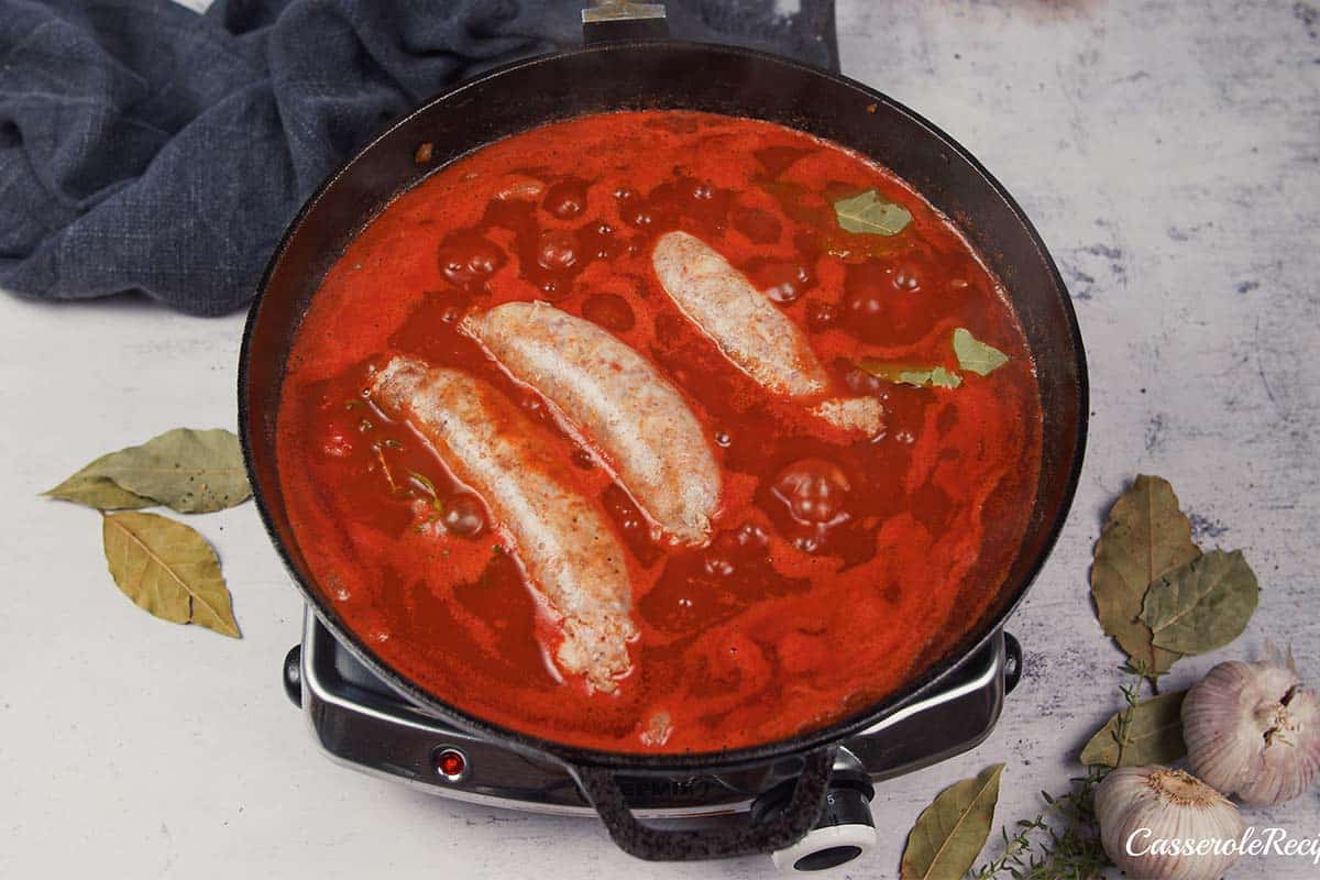 final step of adding the sausages to the other ingredients to make best ever sausage casserole