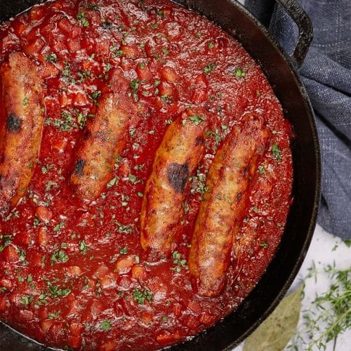 best ever sausage casserole in a cast iron skillet ready to enjoy