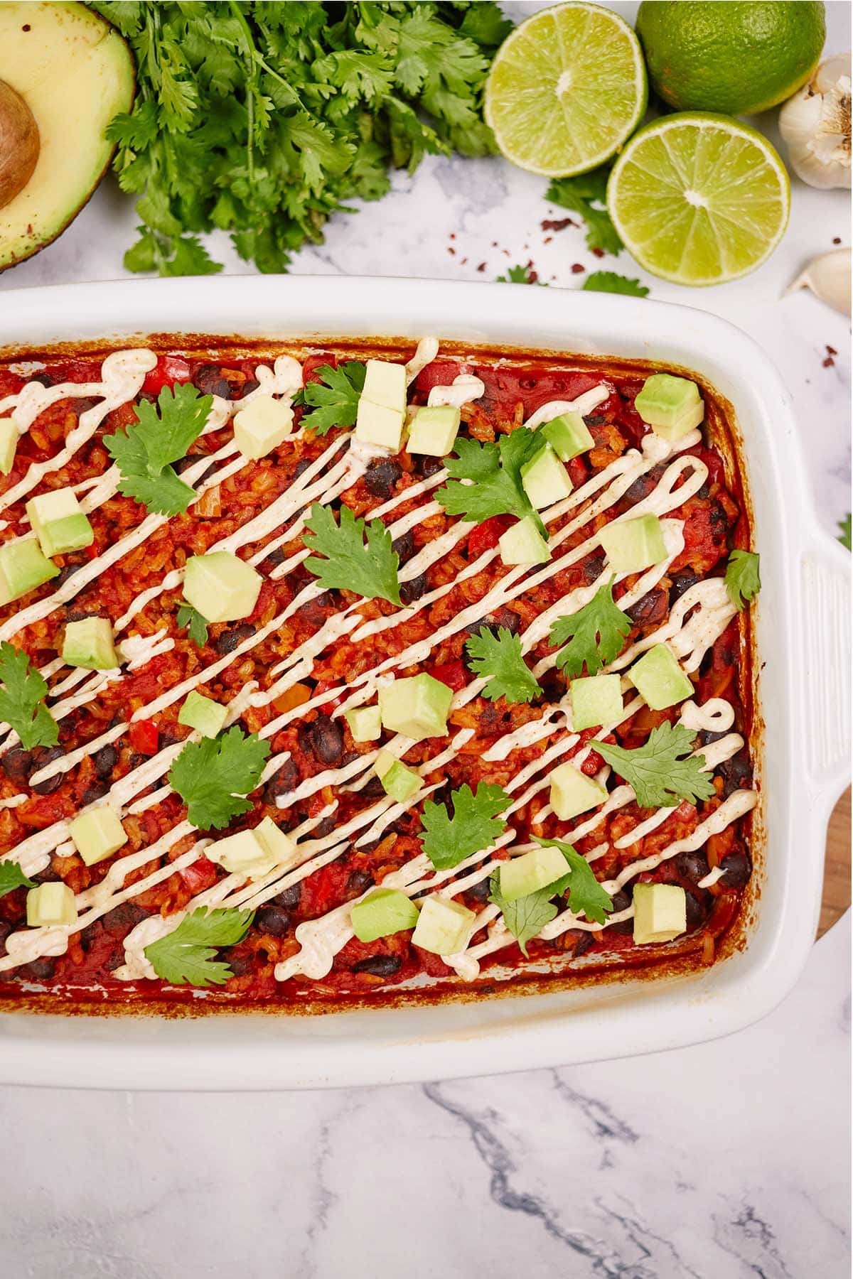 baking dish with garnished chipotle black bean dump and bake casserole ready to serve