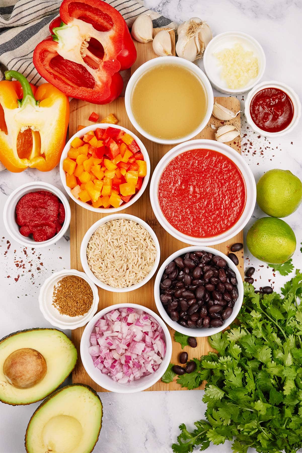 overhead view of ingredients to make chipotle black bean dump and bake casserole laid out on a table