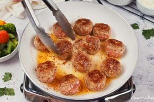 cooking meatballs to make creamy meatball casserole