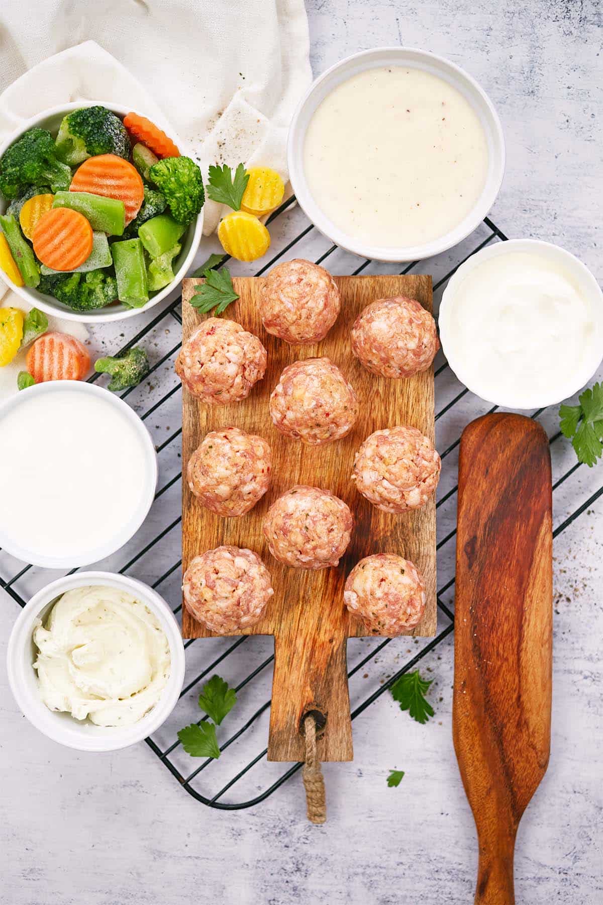 ingredients to make creamy meatball casserole laid out on a table