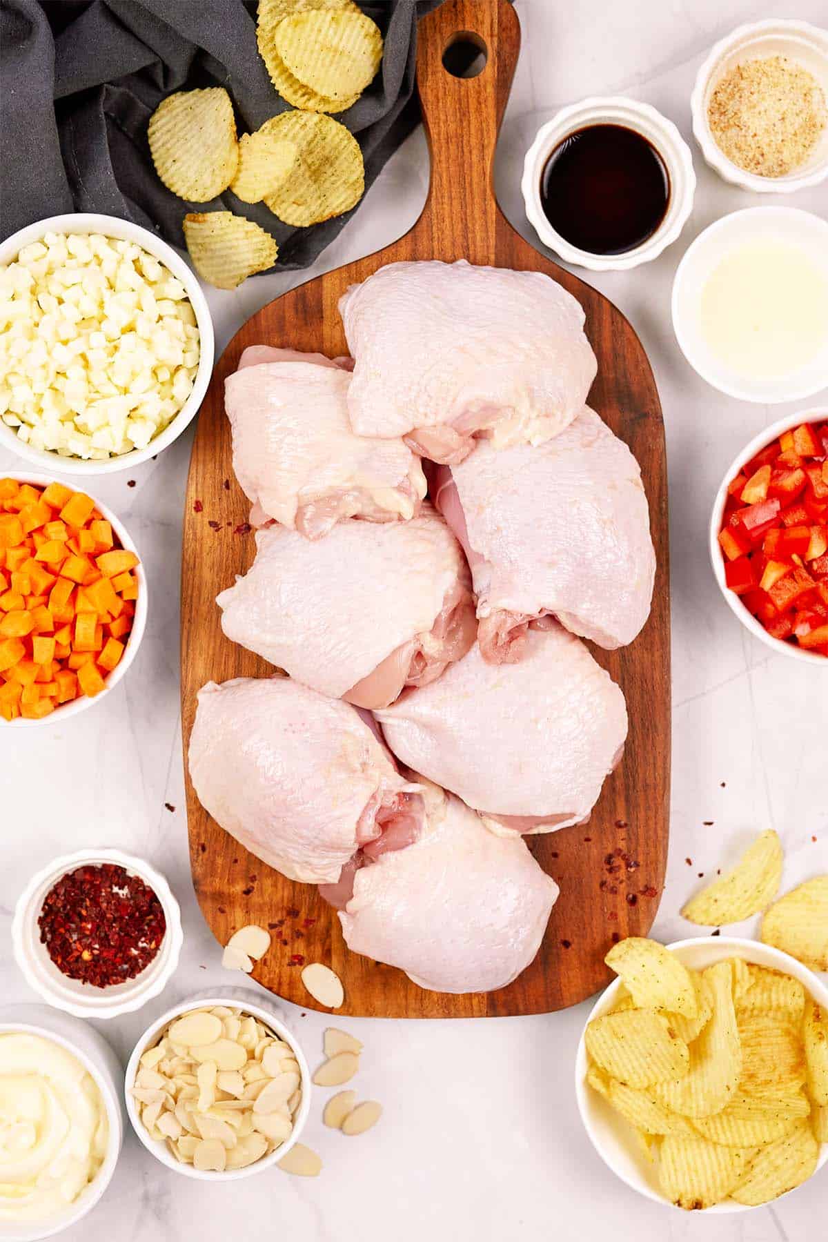ingredients to make hot chicken salad bake laid out on a table