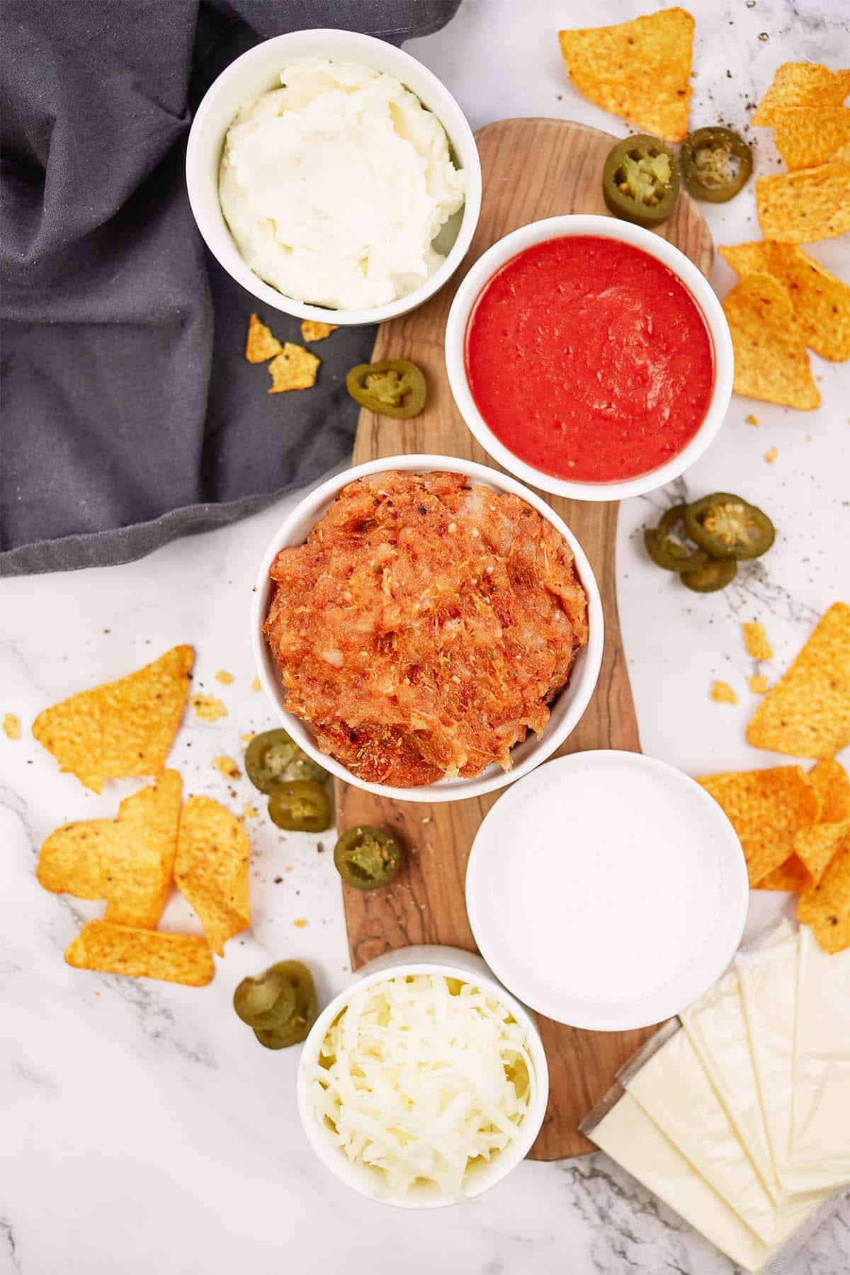 ingredients to make hot sausage dip laid out on a table