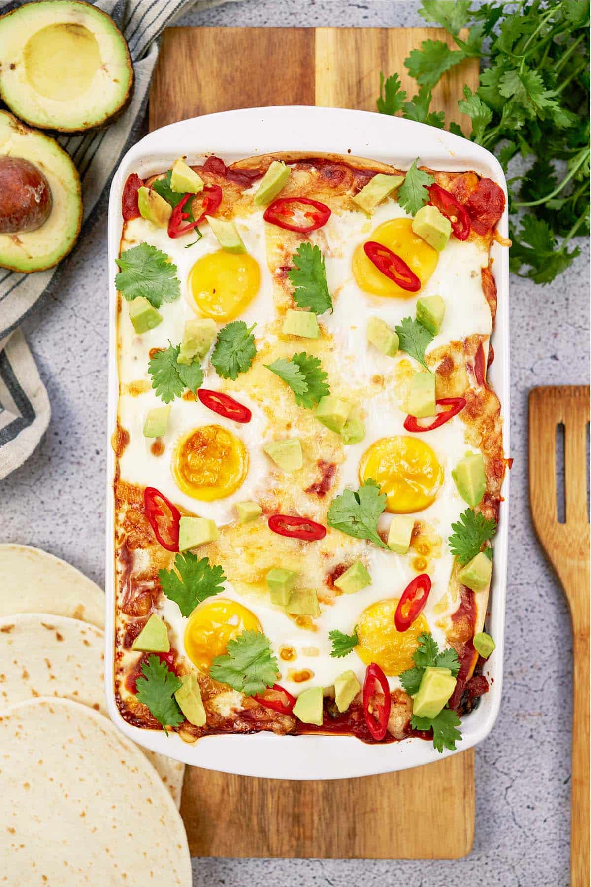 baking dish of huevos rancheros casserole fresh from the oven ready to serve