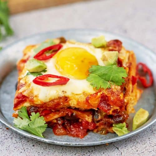 serving of huevos rancheros casserole on a plate ready to enjoy