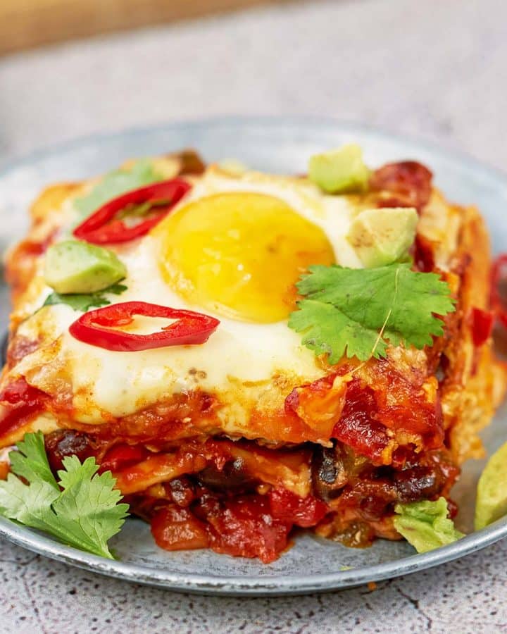 serving of huevos rancheros casserole on a plate ready to enjoy