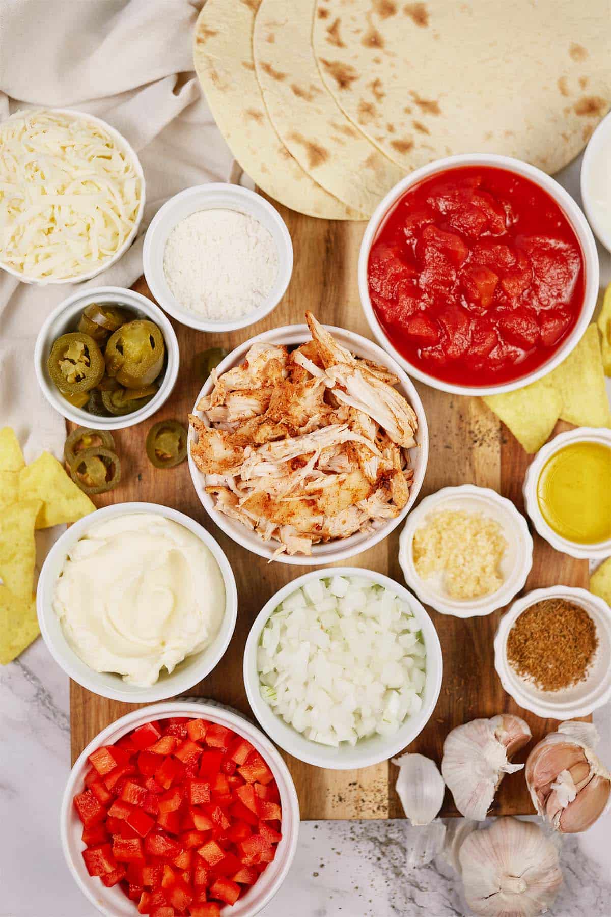 ingredients to make king ranch chicken casserole laid out on a table